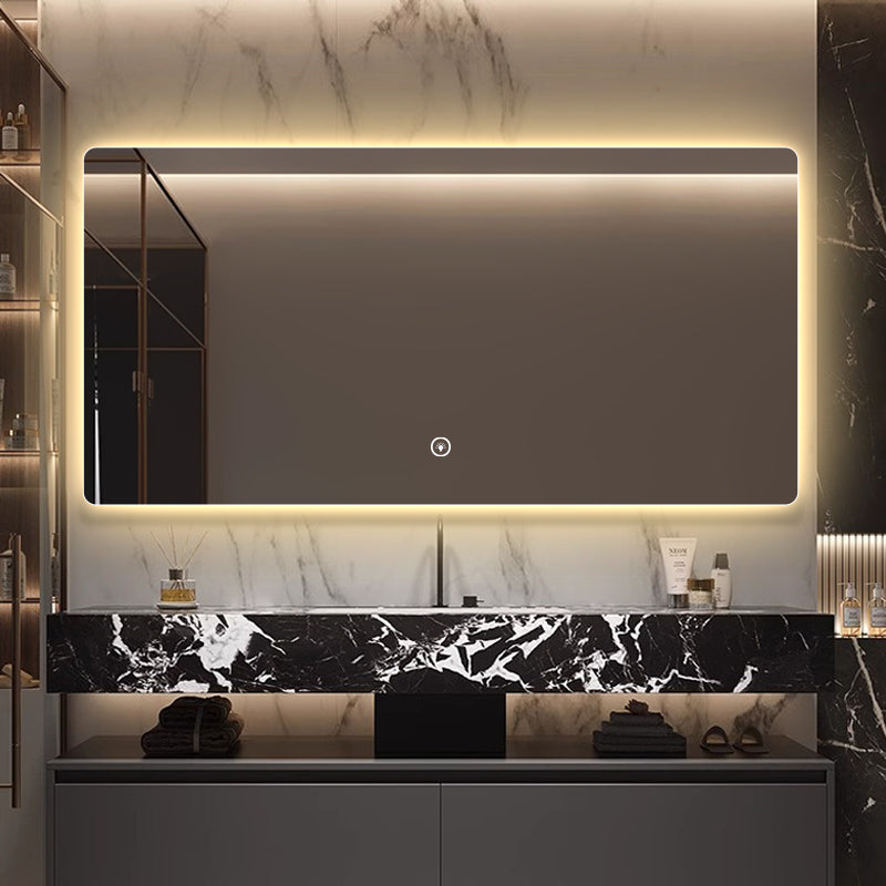 Frameless rectangular backlit LED bathroom mirror.